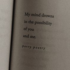 an open book with a poem written in black on the page and white lettering that reads, my mind drowns in the posibilily of you and me