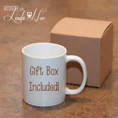 a white coffee mug with the words gift box included