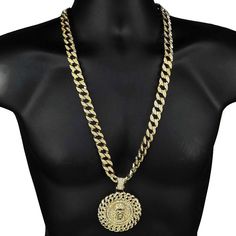 Jesus medallion pendant chain necklace. Cuban chain is 30" inch x 15 mm wide. Every chain link is encrusted with stones. Medallion Jesus pendant is 2.5" diameter. Stunning pendant has a cuban link design. Pendant necklace weighs 195 grams. Gold finish over high quality base metal. Stylish and secure box clasp closure. A truly incredible Jesus chain masterpiece. 100% FREE SHIPPING in US. Order now! Metal Medallion Necklace With Gold Chain, Medallion Necklace With Gold Chain, Metal Medallion Necklace With Adjustable Chain, Metal Medallion Chain Necklace With Adjustable Chain, Adjustable Metal Medallion Chain Necklace, Metal Figaro Chain Necklace, Metal Jewelry With Round Rope Chain, Metal Pendant Chain Necklace With Curb Chain, Gold Medallion With Curb Chain Jewelry