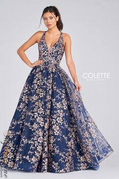 This stunning dress is perfect for a special occasion. The Colette CL12223 features a cracked ice design, lace accents, and a tulle skirt. It's sure to make you feel like a princess on your big day! Prom Dress With Gold, Blue Tulle Prom Dress, Glitter Prom Dress, Daphne Dress, Gold Prom Dresses, Prom Ball Gown, Prom Dress Stores, Prom Dress Styles, Blue Tulle