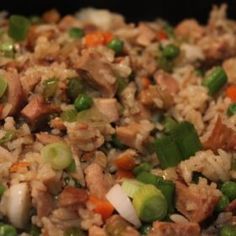 rice and vegetables are mixed together in a skillet