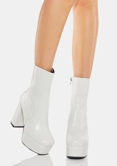 have a vegan leather construction, block heels, chunky soles, and side zip closures. Shoes Boutique, Heel Combat Boots, Dolls Kill Shoes, Black And White Heels, Heels Chunky, Side Zip Boots, Boots White, Stunning Shoes