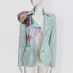 CHRISTIAN LACROIX water green silk jacket with floral brocade, ruffled collar and silk ponpon on the shoulder vintage 80s Amazing silk blazer jacket by French brand Christian Lacroix. The jacket has a slightly fitted cut and a beautiful plunging ruffled neckline with a print on the reverse. There are two front pockets and a single button to close it. The short jacket is decorated with strips of silk scarves in purple tones, creating a sort of pom-pom on one of the shoulders. The jacket is made f Elegant Green Silk Outerwear, Spring Party Blazer With Ruffles, Green Silk Outerwear For Spring, Green Spring Party Blazer, Wedding Blazers, 80s Jacket, Silk Coat, Silk Blazer, Purple Tones