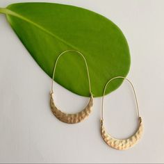 Crafted From Gleaming Yellow Gold-Tone Metal, These Intricately Hammered Tribal Crescent Moon Hoop Earrings Offer A Boho Vibe, Unique In Their Size, Color, And Markings Due To Their Handcrafted Origin. Two-Sided For Versatility. Drop Length: 2.4 Inches Width At Widest Point: 1.4 Inches Materials: Yellow Tone Base Metal Crescent Hammered Earrings, Semi-circle Metal Hoop Earrings, Metal Earrings With Moon Charm, Adjustable Moon Charm Earrings, Metal Semi-circle Hoop Earrings For Pierced Ears, Gold Hoop Earrings With Moon Charm, Crescent Hoop Earrings With Ear Wire, Semi-circle Metal Hoop Earrings For Pierced Ears, Hoop Earrings With Moon Charm