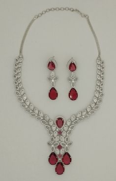 Anny American Diamonds Sapphire Necklace Earrings Set, Bridal Necklace Earrings Jewelry Set, Statement Necklace Earring, Engagement Red Set ITEM DESCRIPTION Metal        =    White Rhodium Plated Occasion  = Wedding ,Party Wear, Bridal Color        =   As per your order Free Shipping Teardrop Necklace With Matching Earrings For Celebration, Festive Teardrop Cubic Zirconia Jewelry, Red Teardrop Jewelry For Celebration, Red Costume Jewelry With Matching Earrings, Red Bridal Necklace With Diamond Accents, Luxury Red Bridal Necklace, Ruby Teardrop Jewelry With Matching Earrings, Teardrop Ruby Jewelry With Matching Earrings, Red Teardrop Cubic Zirconia Jewelry