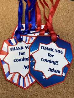 two red, white and blue tags with the words thank you for coming adam