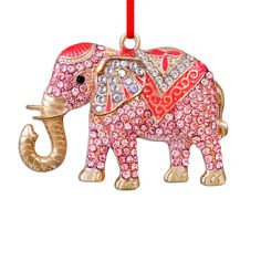 an elephant ornament with pink and red crystals