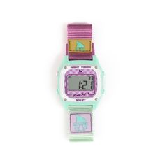 Step into the vibrant vibes of the 60s surf scene with Gingham Pink Shark Watch - the latest addition to our Hippie Chic Collection! This watch channels the carefree spirit of those laid-back beach days with its pink and white gingham face, accented by seafoam green and purple neon touches. But style isn't all this watch offers. Embrace the groovy 60s aesthetic with the iconic Clip closure, ensuring a secure fit for all your adventures. Dive into practicality with its water-resistant design, per Shark Clip Watch, 60s Surf, Shark Watch, 60s Aesthetic, Freestyle Watch, Pink Shark, Purple Neon, Shark Clip, The 60s