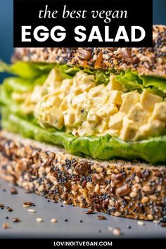 an egg salad sandwich with lettuce and sesame seeds