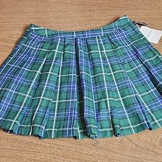 Forever 21 Plaid Skirt Green, Blue, White, And Black Pleated No Stretch New With Tags, And Extra Button 100% Polyester Size- Medium Approximate Measurements (Laid Out Flat): Waist- 12.5" Length- 15" Preppy Pleated Mini Skirt, Forever 21 Pleated Flared Skort, Preppy Lined Mini Skirt For School, Preppy Short School Skirt, Forever 21 High-waisted Pleated Mini Skirt, Forever 21 Pleated Mini Skort, Preppy Green Pleated Skirt, Preppy Mini Skirt For School, Green Pleated Preppy Skirt