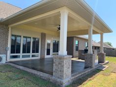 the front porch of a house with an attached patio