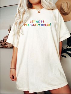 Perfect for Pride Month, Be queer Shirt is soft and empowering. Q U I C K * F A C T S * ♥️ 100% Soft cotton ♥️Design is high quality digital print ♥️ Wash and dry normally. Do not iron directly on the print. * S I Z I N G * ♥️ Sizing is unisex so runs like men's ♥️Most women find their typical size works best. ♥️ Please see size guide in last listing photo for all measurements and information I would recommend sizing up for an oversized fit. * S H I P P I N G * T I M E S * ♥️ Our items are indiv No Sleeve Shirt Outfit, Queer Shirt Designs, Pride Shirt Design, Pride Tshirt Design, Diy Pride Shirt, Simple Pride Outfit, Pride Day Outfits, Subtle Pride Outfit, Queer Tshirts