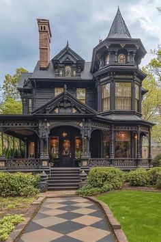 an old victorian style house with black and white checkerboard flooring in front