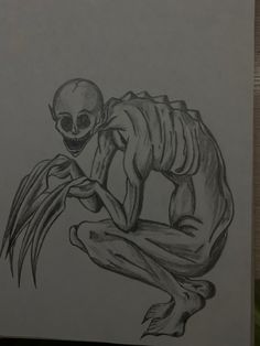 a drawing of a skeleton sitting on top of a piece of paper