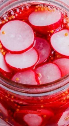 pickled radishes in a jar filled with water