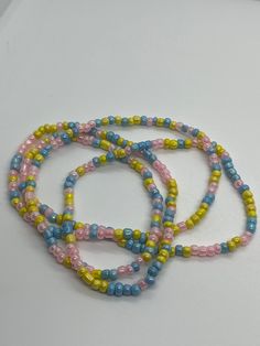 yellow, blue and pink beaded waist beads Multicolor Beaded Waist Beads For Summer, Multicolor Round Waist Beads For Summer, Multicolor Round Beads Waist Chain, Multicolor Round Beaded Chain Waist Beads, Multicolor Beaded Chain Waist Beads, Multicolor Waist Beads For Summer Beach, Multicolor Waist Beads For Beach In Summer, Seed Bead Jewelery, Suffolk Va