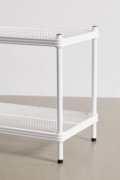 a white shelf sitting on top of a floor