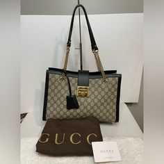 Brand New! Comes With Coa & Gucci Dust Bag. Still In Stores. Beige/Ebony Gg Supreme Canvas. Micro-Fiber Lining. Key With Leather Holder. Interior Zip Pocket & Slip Pockets. Double Chain Shoulder Straps With 24.5cm Drop. Gucci Top Handle Shoulder Bag With Turn-lock, Gucci Rectangular Satchel With Branded Hardware, Gucci Shoulder Bag With Turn-lock For Travel, Designer Gucci Bag With Lock, Elegant Gucci Shoulder Bag With Turn-lock Closure, Luxury Gucci Bag With Lock, Gucci Satchel With Branded Hardware For Shopping, Gucci Travel Bag With Turn-lock Closure, Gucci Bag With Turn-lock Closure For Travel