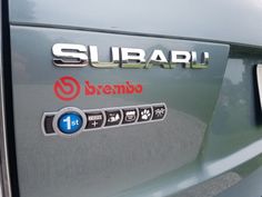 there is a subaru sticker on the side of a car