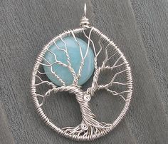 a tree of life pendant is shown on an instagramtion page with the caption below