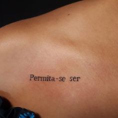 a woman's back with the word permit se ser tattooed on it