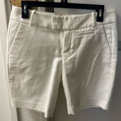 Calvin Klein 97% Cotton 3% Spandex Stretch Cotton Calvin Klein Bottoms, Calvin Klein Stretch Cotton Bottoms, Calvin Klein Casual Workwear Bottoms, Chic Calvin Klein Bottoms For Spring, Chic Spring Bottoms By Calvin Klein, Calvin Klein Fitted Casual Shorts, White Fitted Bermuda Shorts Casual, Spring Calvin Klein Mid-rise Bottoms, Calvin Klein Fitted Shorts