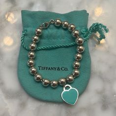 Tiffany & Co Enamel Heart Tag Beaded Bracelet. Barely Worn, Very Minor Wear. Authentic 925 With Tiffany & Co Engravings On Both Sides Of The Tag. One Side Of The Heart Tag Is Enameled Tiffany Blue, The Other Side Is Engraved Silver “Please Return To Tiffany & Co New York 925”. Includes Tiffany & Co Pouch. Tiffany Blue Bracelet, Elegant Silver Beaded Bracelets For Valentine's Day, Luxury Sterling Silver Beaded Bracelets For Gifts, Luxury Silver Beaded Bracelets As Gift, Tiffany Bead Bracelet, Tiffany And Co Bracelet, Jewelry Tiffany, Return To Tiffany, Heart Tag