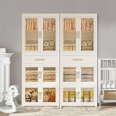 a baby's room with white furniture and accessories