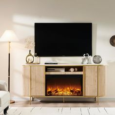 a living room with a television and fire place