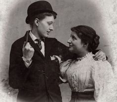 an old black and white photo of two people