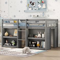 a child's bedroom with grey bunk beds and stars on the wall behind them