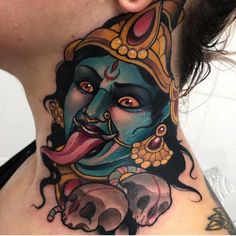 a woman's neck is adorned with an image of the hindu god ganesh