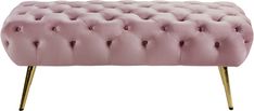 a pink bench with gold legs and buttons on it's back end, in front of a white background