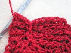 the crochet is being worked on with scissors