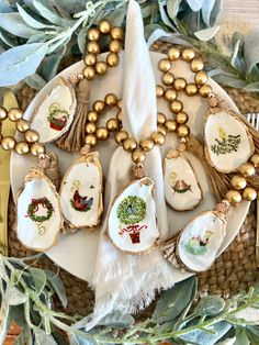 a plate topped with lots of cookies covered in icing and decorated with christmas decorations