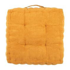 an orange square cushion on a white background