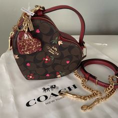 Cute Over The Shoulder Bags, Just Because Gifts For Her, Coach Bag Collection, Elegant Purses Classy, Cherry Coach Purse, Pretty Purses And Handbags, Heart Coach Bag, Girly Bags Purses, Cute Coach Purses