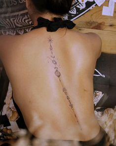 a woman with a tattoo on her back