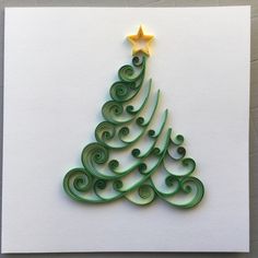 a christmas tree made out of green spirals and a star on top of it