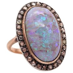 Victorian classic cocktail ring with opal. Gorgeous antique ring, created during the Victorian period in England, back in the 1880. The beautiful statement cocktail ring has been designed with classic patterns in an oval shape. It was crafted in yellow gold of 14 karats with a bezel made in .800/.999 silver for the setting of the thirty two rose cut diamonds. The settings of the gemstones are finished with millegrain technique. Opal: Mount on top in a bezel setting, with 1 oval cabochon cut (19 Expensive Diamond, Opal Diamond Ring, Thirty Two, Precious Opal, Types Of Opals, Victorian Period, Garnet And Gold, Classic Cocktail, Antique Ring