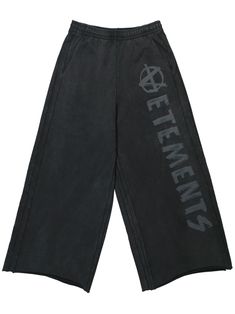 washed black cotton blend elasticated drawstring waistband slip pockets to the sides logo print to the side wide leg raw-cut hem When buying this unisex item, keep in mind that it is graded in standard men's sizing. Vetements Sweatpants, Baggy Sweats, Baggy Track Pants, Afro Punk Fashion, Fashion Dark, Girlfriend Christmas, Baggy Sweatpants, Shopping Clothes, Y2k Sweater