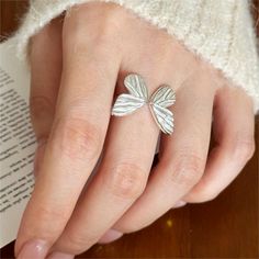 This 925 Sterling Silver Spirit Vivid Butterfly Plain Ring is a classic piece with a timeless design. Crafted from premium 925 sterling silver for durability, it features a vivid butterfly design that's sure to add a simple, elegant touch to any wardrobe. Product Details Material: 925 Silver Color: White Gold Plated Size: US Size #6.5 Adjustable Weight: about 3.4g SKU: AR23101816 Product Keywords: Distorted band rings, Avante-garde rings, Unique shaped rings, vintage rings, vintage band rings, g Elegant Silver Leaf-shaped Ring, Elegant Sterling Silver Rings With Butterfly Charm, Minimalist Silver Butterfly Promise Ring, Silver Elegant Butterfly Open Ring, Elegant Silver Butterfly Open Ring, Silver Ring With Butterfly Charm, Gift Butterfly Open Ring, Silver Butterfly Ring For Anniversary, Plain Rings