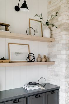 a shelf with some pictures and other items on it