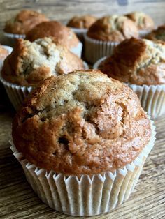 several muffins sitting on top of a wooden table