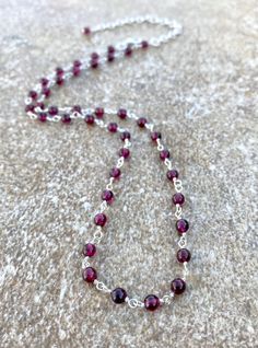 Garnet necklace Made with 4mm Garnet beads, Sterling silver wire and Lobster clasp. Necklace measure is 16 inches + 3inches extended chain. **Custom size are welcome. Beaded Necklace With Sterling Silver Clasp As Gift, Beaded Necklaces With Sterling Silver Clasp As Gift, Sterling Silver Beaded Necklace Gift, Gift Beaded Necklaces With Sterling Silver Clasp, Single Bead, Clasp Necklace, Garnet Necklace, Necklace Beaded, Necklace Sterling Silver