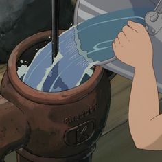 a person is pouring water into a pot