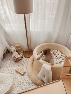 a baby playing in an indoor bubble bath