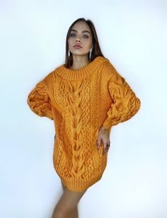 Oversized sweater-dress made of soft, body-friendly merino wool blend yarn, with open shoulders and puffed sleeves. You can order this sweater in a long sweater dress version or in a regular size 60cm sweater. In the photo, the model is 170 cm tall, size S-M, wearing a sweater in size L, color orange -837. Size options: Size XS-S: Width - 45 cm, Length - 70-71 cm. Size M: Width - 50 cm, Length - 75 cm. Size L: Width - 55-57 cm, Length - 77 cm. Size XL: Width - 58-60 cm, Length - 77 cm. Size XXL: Cozy Chunky Knit Dress, Oversized Knitted Sweater Dress, Sweater Dresses For Women, Cable Sweater Dress, Hand Knit Sweater, Sweater Dress Oversized, Wool Sweaters Womens, Dress One Shoulder, Long Sweater Dress