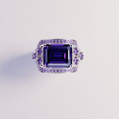 Introducing The Violet Love: This bold statement ring is perfect for any occassion. As a gift for her, a wedding ring or a gift for yourself - because you deserve it - it is guaranteed to impress. This ring is made as a 3-in-1 triple ring set. 2 perfectly fitting bands to complement the big bold center main ring. A bold and beautiful simulated amethyst sits like a crown in the center of a gemstone halo. The sides covered with beautiful simulated diamonds and purple enamel. Underneath you have pr Elegant Diamond Amethyst Ring As Gift, Luxury Purple Jewelry Gift, Elegant Amethyst Ring With Cubic Zirconia For Gift, Elegant Rings With Accent Stones As Gift, Elegant Rings For Mother's Day, Elegant Accent Stones Jewelry For Valentine's Day, Silver Ring For Formal Occasions And Mother's Day, Formal Jewelry With Accent Stones For Valentine's Day, Silver Ring For Formal Occasions On Mother's Day