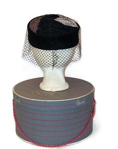 Sixties flat top pillbox hat with black velvet crown and a top with swirls of brown, cream and black topped with a black velvet button and surrounded by birdcage veil. Label: Made in USA Condition is excellent. Measurements Inside circumference: 22 inches, 57 cm Crown height: 2.25 inches, 5.5cm All my items are vintage and may have signs of wear. I try to show any imperfections or damage and the price will reflect them. Yes, I ship internationally. FOR AN ACCURATE SHIPPING QUOTE PLEASE CONTACT M Retro Black Mini Hats For Party, Vintage Cap-shaped Party Fascinator, Black Retro Fascinator For Vintage Events, Adjustable Black Vintage Fascinator, Vintage Cloche Mini Hat For Evening, Vintage Evening Cloche Mini Hat, Vintage Black Flat Cap, Retro Cloche Mini Hat For Formal Events, Retro Cloche Mini Hat For Formal Occasions